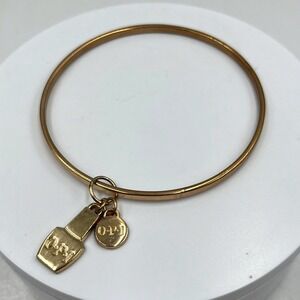 Vintage OPI Gold Tone Bangle Bracelet with Nail Polish Bottle & Logo Disc Charms